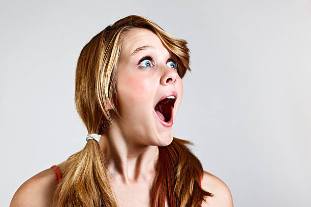 Pretty teenager is delighted and surprised