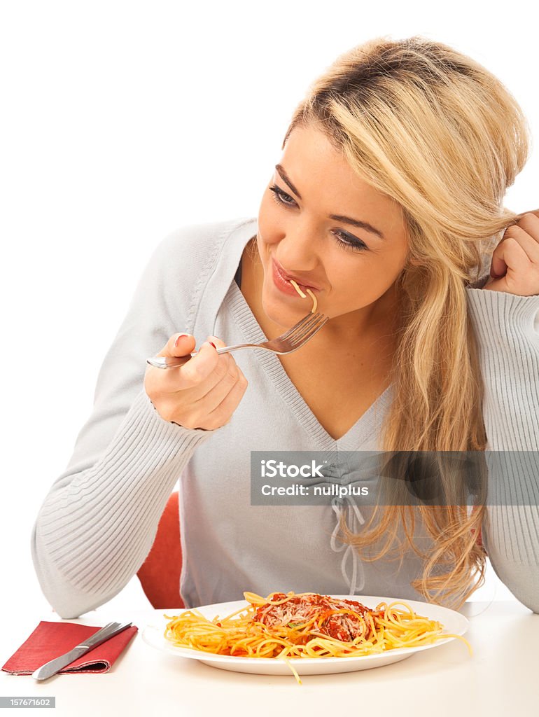 young woman having spaghetti 20-29 Years Stock Photo