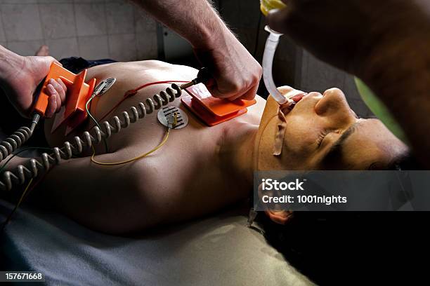 Doctors At Er Stock Photo - Download Image Now - Accidents and Disasters, Defibrillator, Color Image
