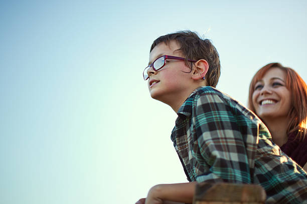 istock Young Boy Looking at View with Mother 157671747