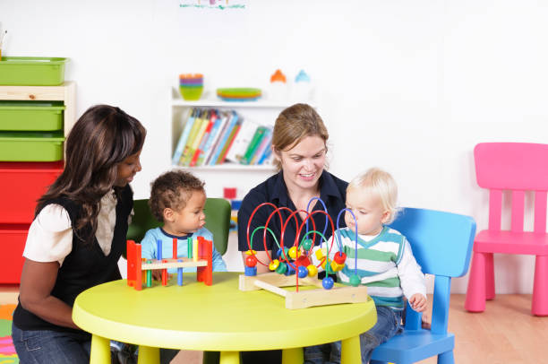 istock Carers Interacting With Babies/ Toddlers In A Nursery Setting 157671814