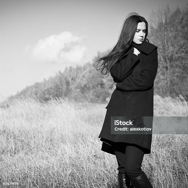 Young Woman In Coat Getting Cold Stock Photo - Download Image Now - Black And White, Fashion, Photography