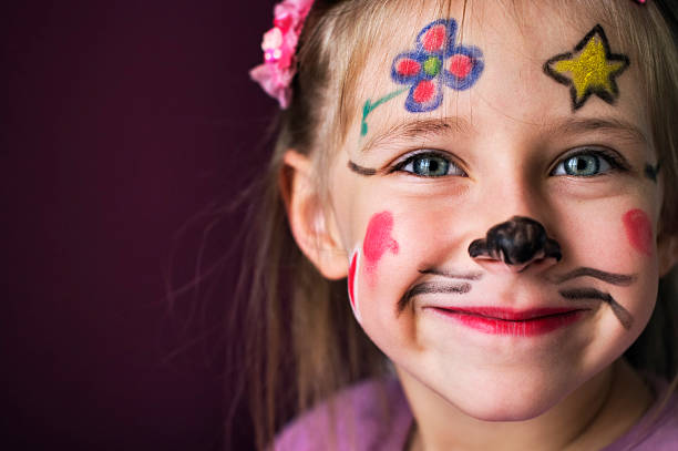 istock Smiling young girl with a painted face 157672071