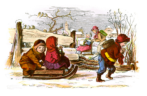 Vintage colour engraving from 1867  of children from the Victorian era sledding and playing in the snow at Christmas time.