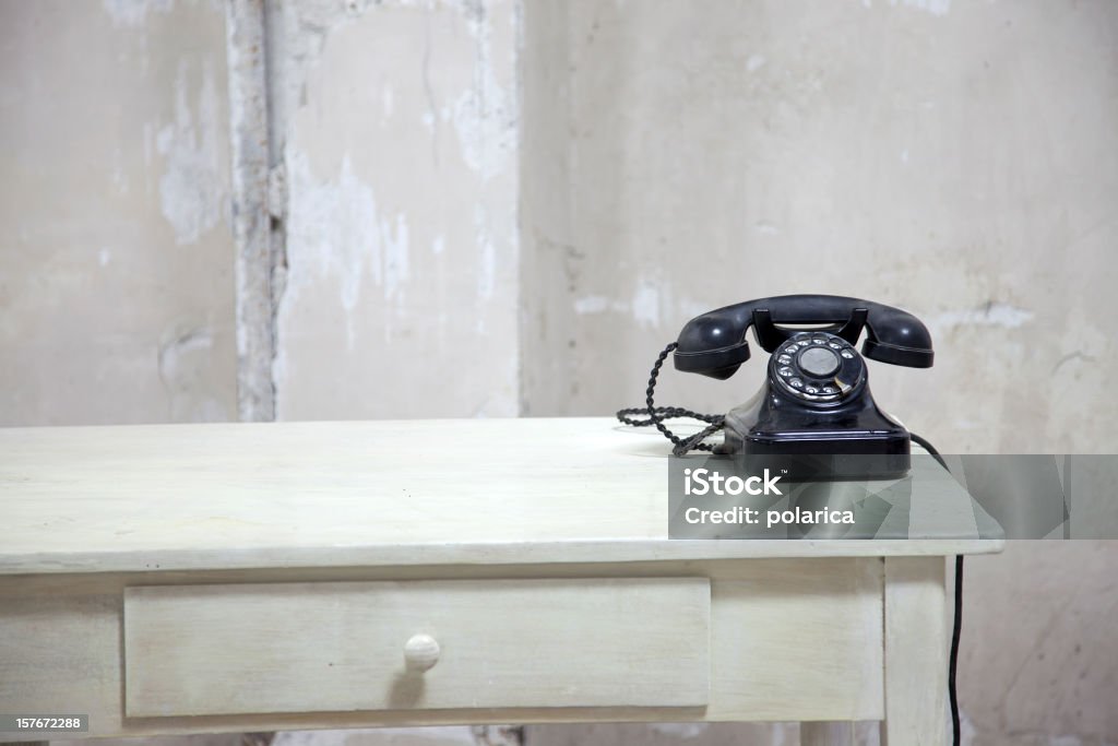 First office series An old black phone on a table Desk Stock Photo