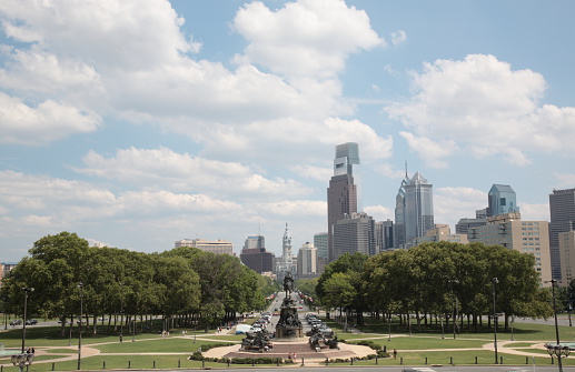 Philadelphia city view, Pennsylvania. The sculpture is in Eakins Oval. Eakins oval is in front of the Philadelphia Museum of Art, and the oval was part of urban planner Jacques Gréber's design for the Benjamin Franklin Parkway. 