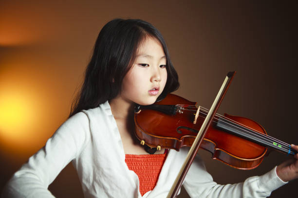 istock Young Asian Violinist 157672660