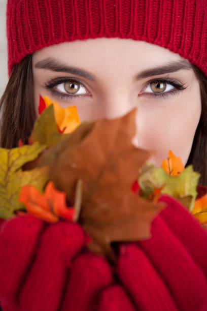 istock Young female holding autumn leaves 157672667