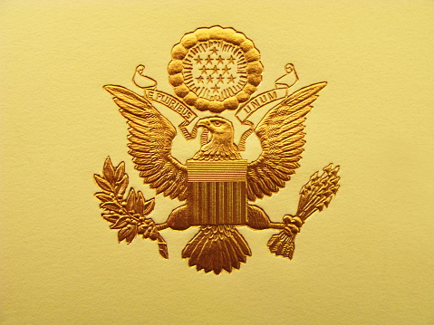 The Seal of the President of the United States is used to mark correspondence from the U.S. president to the United States Congress, and is also used as a symbol of the presidency. The central design, based on the Great Seal of the United States, is the official coat of arms of the U.S. presidency and also appears on the presidential flag.  The stripes on the shield represent the 13 original states, unified under and supporting the chief. The motto (meaning 