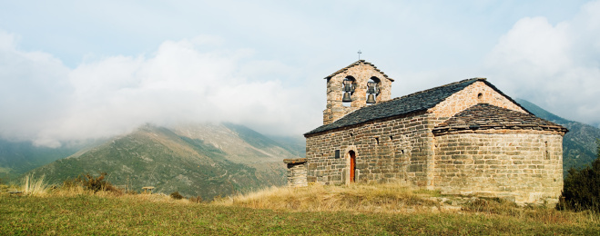 Mountain landscape with the small church of Durro. National Park of Aiguestortes, Pyrenees. Catalonia.