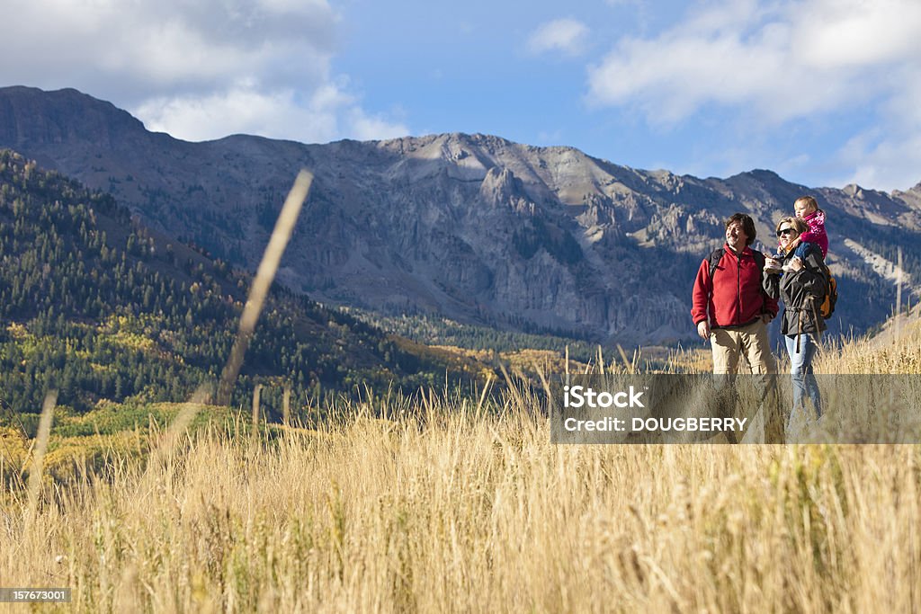 Family Hiking Man and woman a small child on shoulders hiking in  mountains Colorado Stock Photo