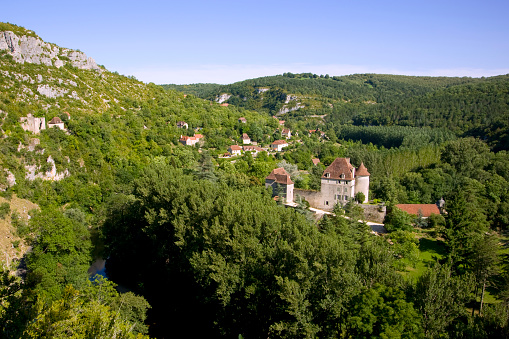 Picturesque rural valley and small chateau, Sauliac Sur Cele, Lot, France