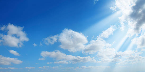 sunshine in clean sky partly  cloudy and sunny blue sky with sunbeam. innocence stock pictures, royalty-free photos & images