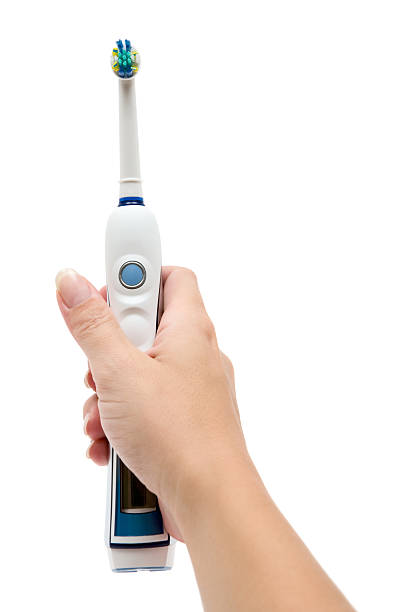 istock Holding An Electric Toothbrush 157673179