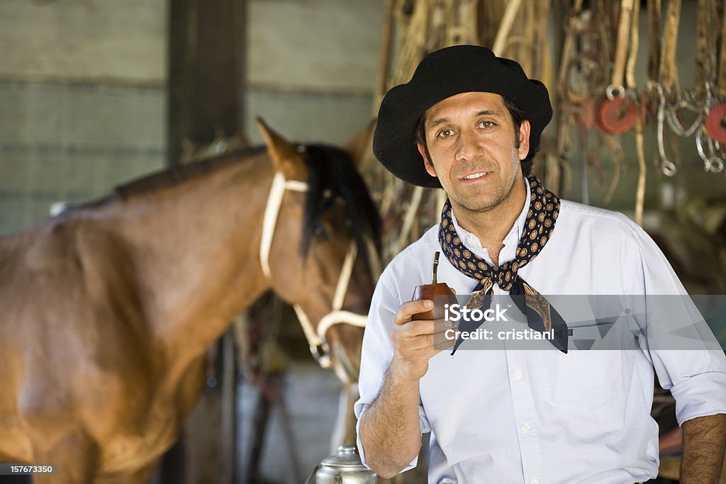 Gaucho Gaucho drinking Yerba Mate and his Horse in a Ranch Gaucho Stock Photo