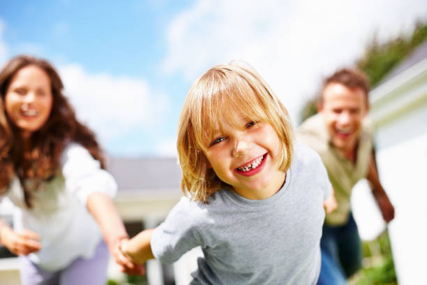 istock Cheerful little boy with his parents having fun 157673374