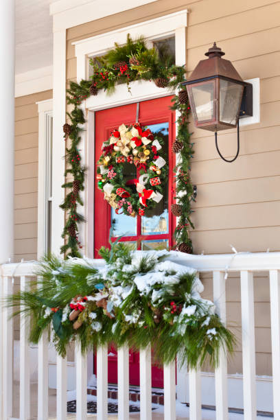 istock snow on porch with Christmas decorations 157673469