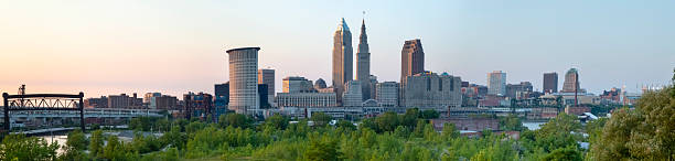 Cleveland Cityscape over Cuyahoga River Panorama Cleveland from the southwest, looking northeast, over the Cuyahoga River. cuyahoga river photos stock pictures, royalty-free photos & images