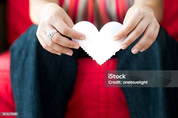 Young Woman Holding Paper Heart Shaped Symbol Stock Photo - Download Image Now - Adult, Adults Only, Casual Clothing