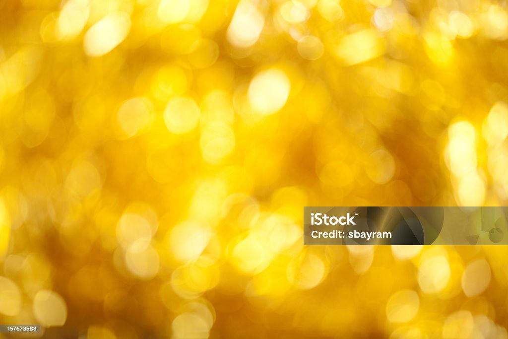 Defocused lights XXXL photo of blurred yellow sparkles. Abstract Stock Photo
