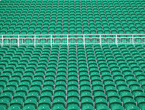 lined up chairs of various types used for outdoor theater