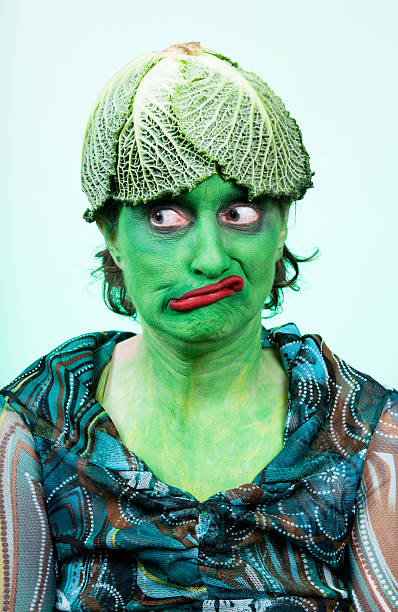 Woman With Green Face Paint Wearing A Cabbage Hat Stock Photo - Download  Image Now - Adult, Adults Only, Cabbage - iStock