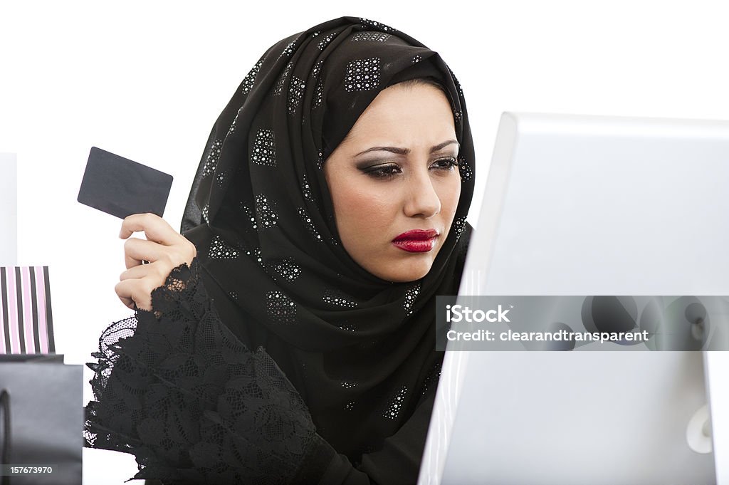 Arabic girl shopping on the internet Arabic girl shopping on the internet, isolated on white. Internet Stock Photo