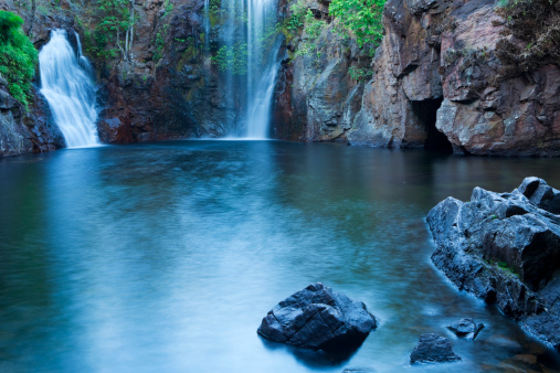 A beautiful tranquil scene with waterfalls photographed at dawn. The Florence Falls in Litchfield National Park, Northern Territory, Australia.