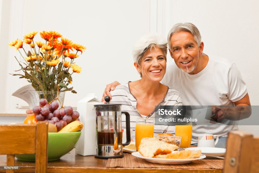 happy senior couple having breakfast senior couple enjoying breakfast together 50-59 Years Stock Photo