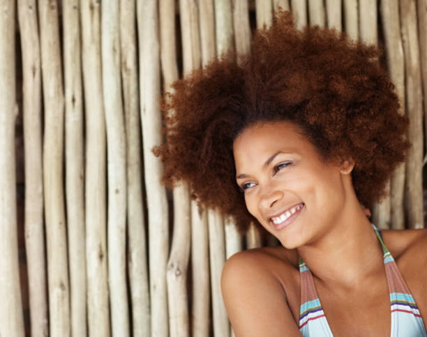 istock Closeup of cute bikini model smiling against a bamboo wall 157674366