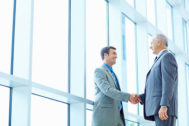 istock Successful business men shaking hands at office 157674472
