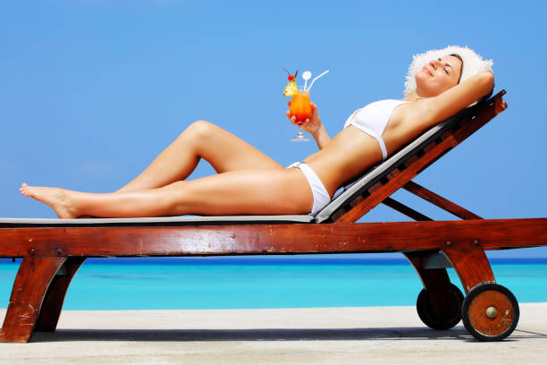istock Lady relaxing in the chair on a exotic resort. 157674481