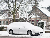 Snow Covered Car on the Street