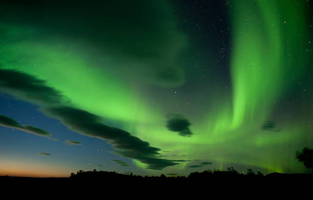 istock The aurora borealis paints the  night sky with green 157674580