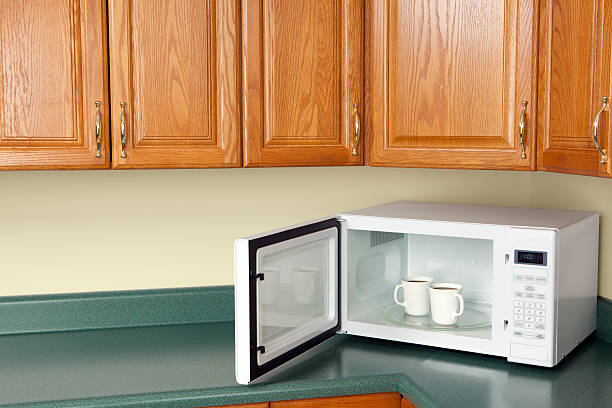 Microwave with Coffee  inside microwave stock pictures, royalty-free photos & images