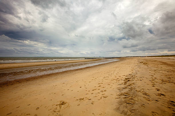 istock Loomy sky over beach wide angle shot on full frame 157674946