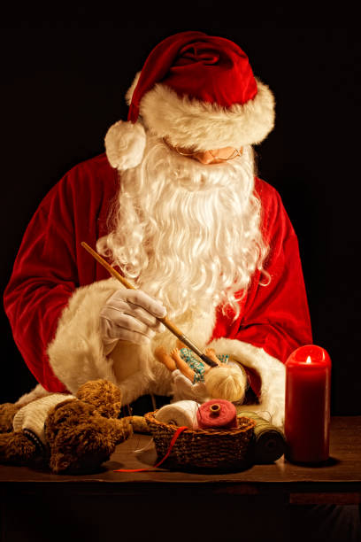 istock Santa Claus painting a toy 157674973