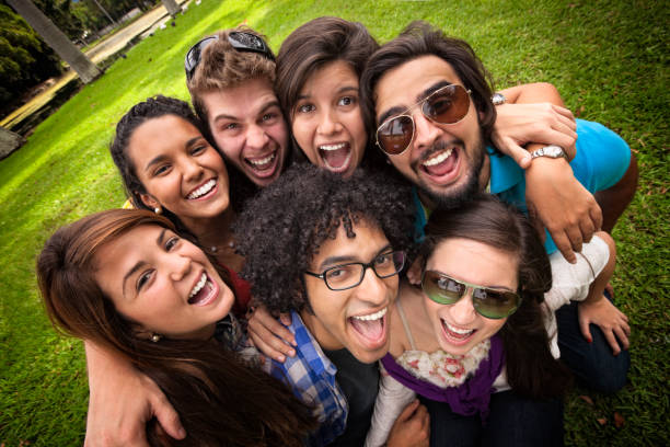 istock Closeup embracing group of young students at the university campus 157674974