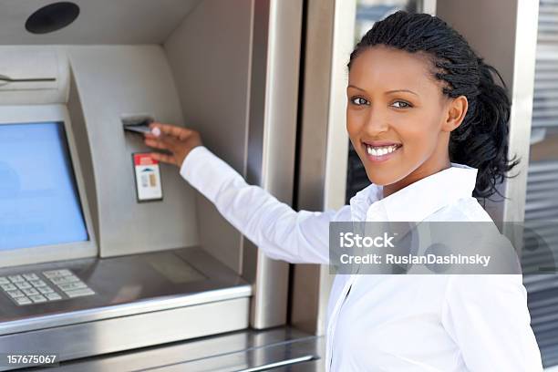 Woman Using Credit Card To Withdraw Cash Money Stock Photo - Download Image Now - 20-24 Years, ATM, Adult