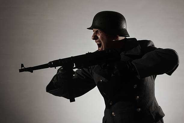 attacking german soldier German soldier attacking with rifle (MP40) nazism photos stock pictures, royalty-free photos & images