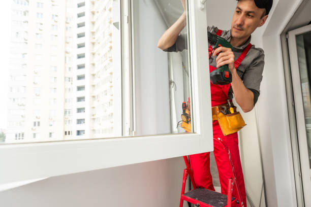 istock Construction worker repairing plastic window with electric screwdriver indoors 1576752957