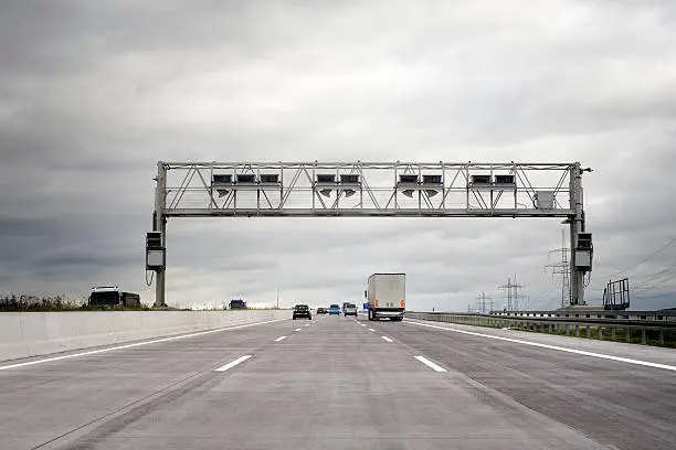 Truck toll system, german highway - control gantry, some minor motion blurring