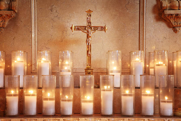 Prayer Candles Prayer candles and crucifix. catholicism stock pictures, royalty-free photos & images