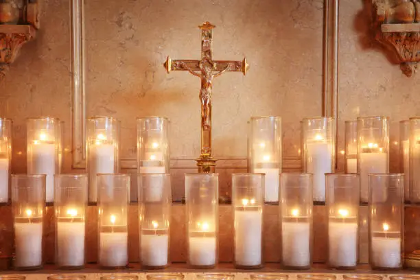 Prayer candles and crucifix.