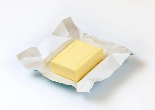 Block of fresh butter in foil