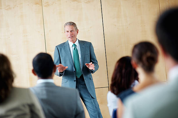 istock Mature business man discussing with his team at a seminar 157675615
