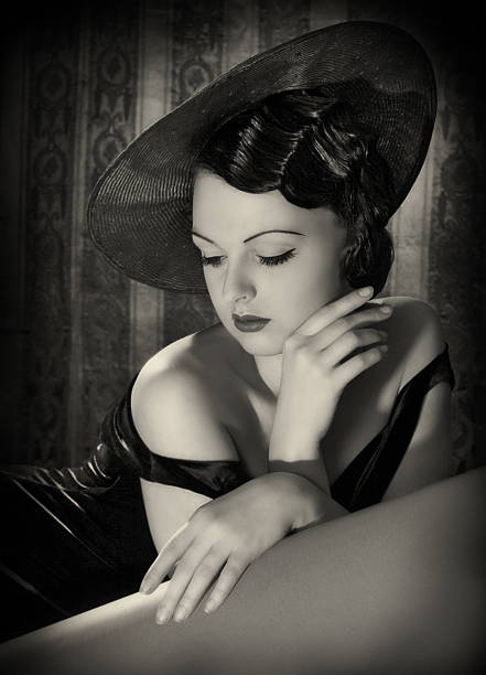 Beauty with hat in film noir style. Emulations of vintage style photography. femme fatale stock pictures, royalty-free photos & images