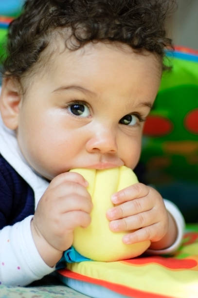 istock Baby Girl ( 9 months old ) is Biting Toys 157675694