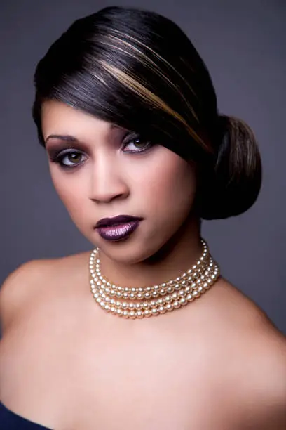 Photo of Ethnic woman with updo