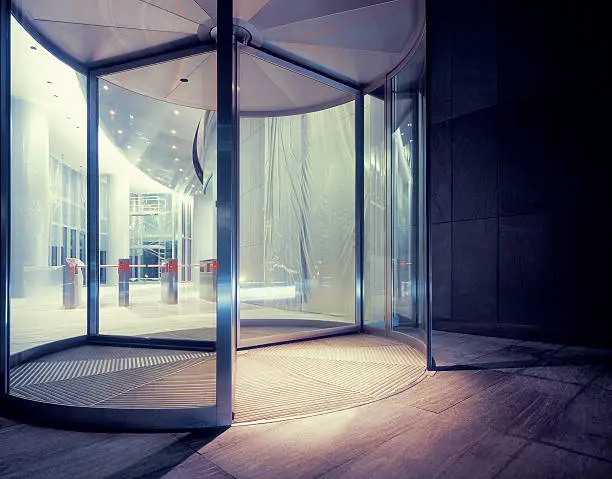 Photo of Revolving door of newly built office building.